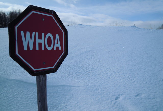 Whoa sign with snow